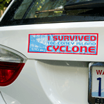 Red and blue on white vinyl I Survived Cyclone bumper sticker on car