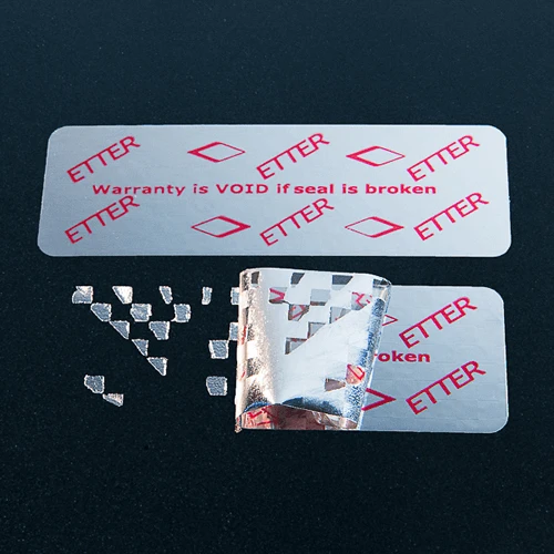 Silver rectangular warning label with red ink and checkerboard residue pattern
