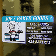 Multi spot-color bakerman with goodies graphic on clear rectangle Joe's Baked Goods custom static cling decal on window