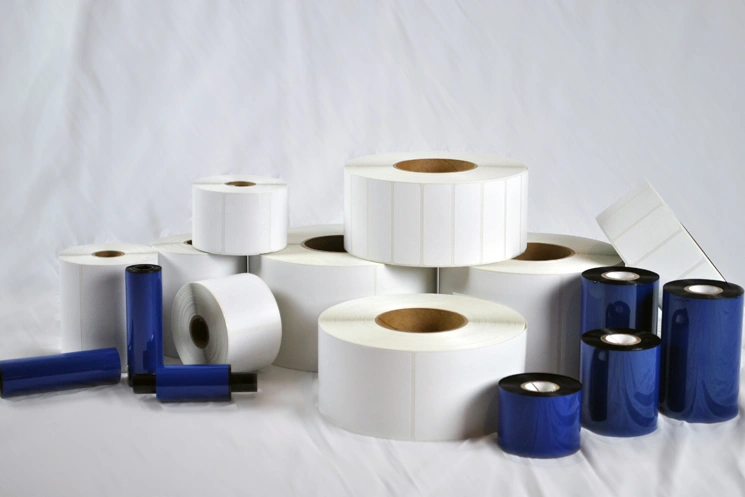 A variety of direct thermal roll labels in different sizes.