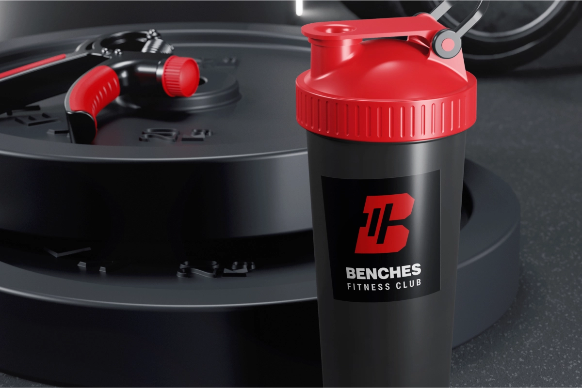 Fitness shaker bottle featuring a custom logo sticker, adding a branded and personalized touch to the workout accessory.