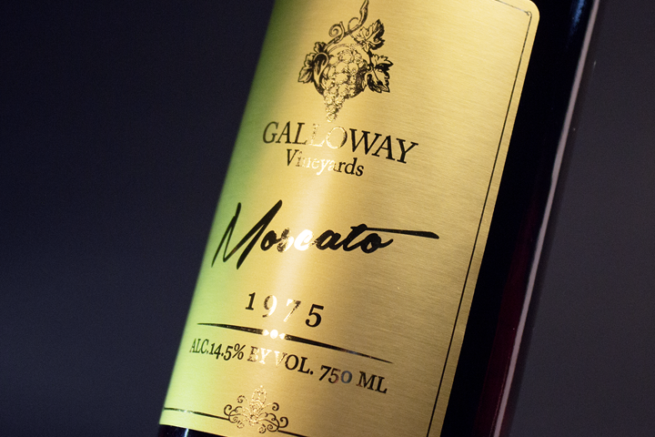A wine label featuring captivating gold foil accents, adding a luxurious and opulent touch to the wine packaging.